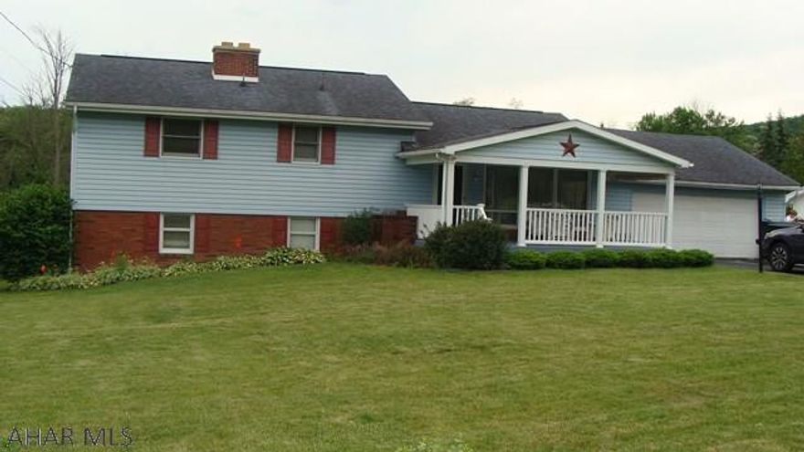 This custom built home sits on almost one acre with a large level back yard. Enter the home from the covered front porch and into the spacious living room. Enjoy the view from your eat in kitchen or from the deck that overlooks the backyard and includes a natural gas grill. This home features three spacious bedrooms with large closets and a nice sized bathroom with a walk in shower. The lower level offers a large space for your family to enjoy and a beautiful two sided brick fireplace. The lower level offers a large workshop, laundry room, powder room, and a bonus room that could be used as an office or play area. Easy access to the back yard through your two siding glass doors in the walkout basement. This home also has a two car attached garage and large driveway for off street parking.