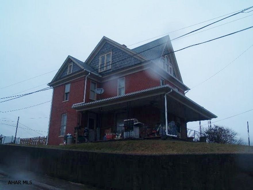 Classic brick home in the Boro of Roaring Spring.  The current owners use this home as a single family investment property.  With some personal touches and updates it would also make a fabulous starter home.  This home has hot water heating and updated electric.  With large rooms on the main level, three bedrooms on the second floor and additional attic for storage this is the quintessential Roaring Spring home.