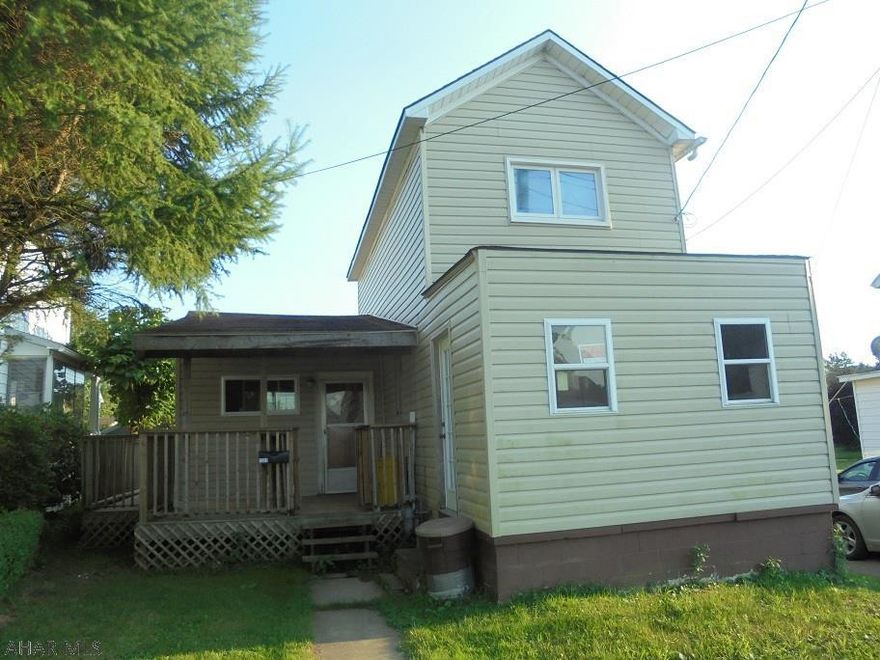 Portage- 2 story vinyl sided home on a 38 x 130 lot.