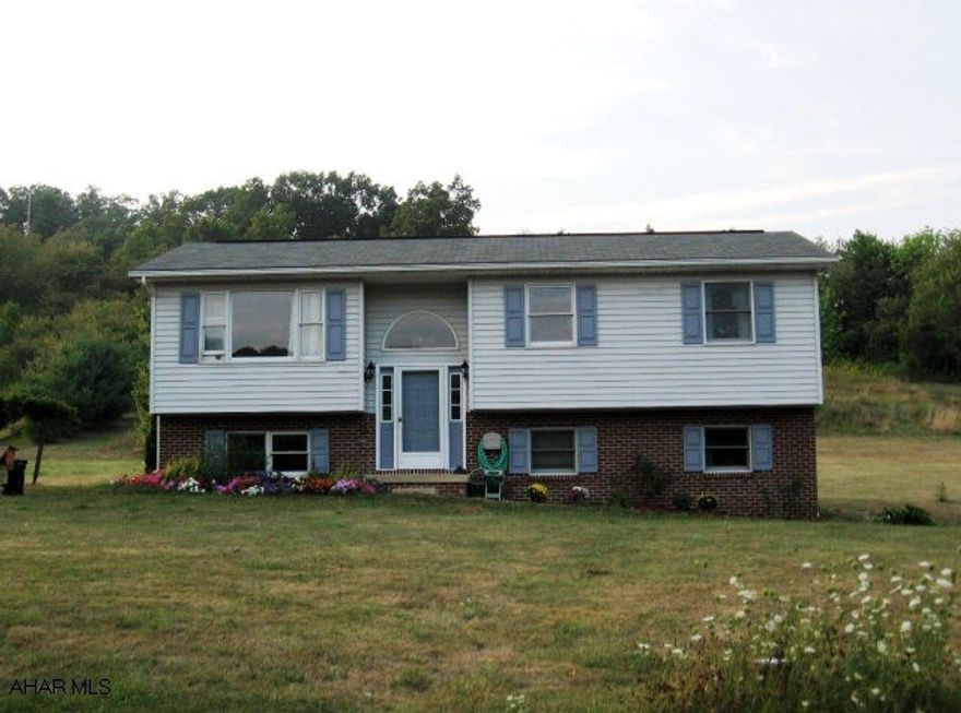 Many upgrades in this 3BR, 2BA on 4 acres with great mt. views. New appliances incl. a convection oven, remodeled bath w/jacuzzi tub, new flooring and new rear deck. Barn could also be used as a garage with room for 4 cars.