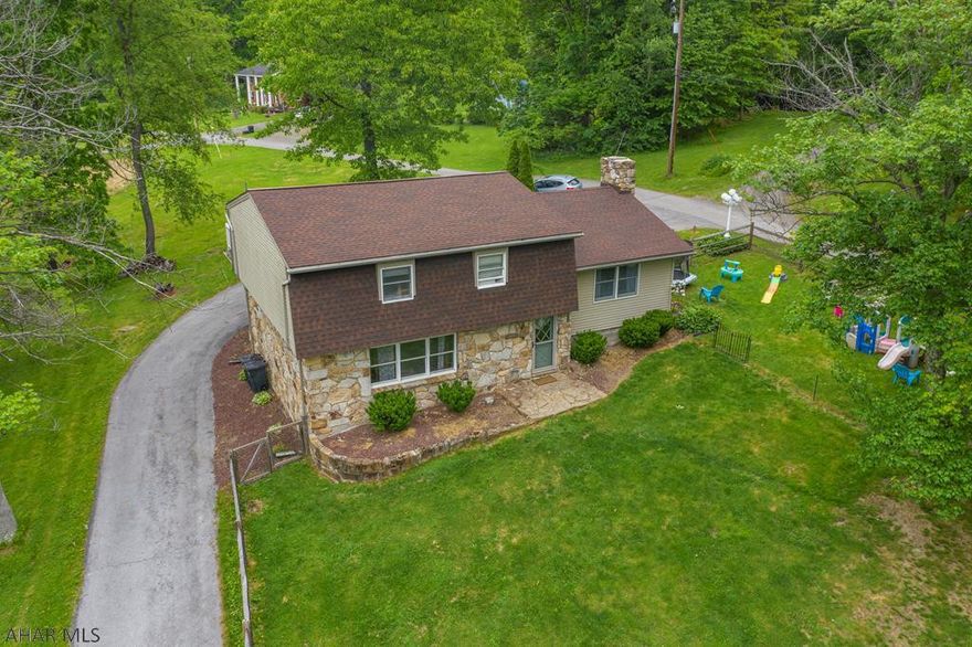 Beautiful 3 bedroom multi level home for sale in the Reservoir Area of Hollidaysburg. Open concept kitchen, dining, wet bar and living room on first floor along with laundry room and half bath. SS Kitchen appliances. Second level is a large great room with gorgeous stone wood burning fireplace.  Huge fenced in yard. Newer roof and heat pump. Sale includes 2 lots. Don't miss your opportunity for this move in ready home! Schedule your showing today! Matterport Virtual Walkthrough available!