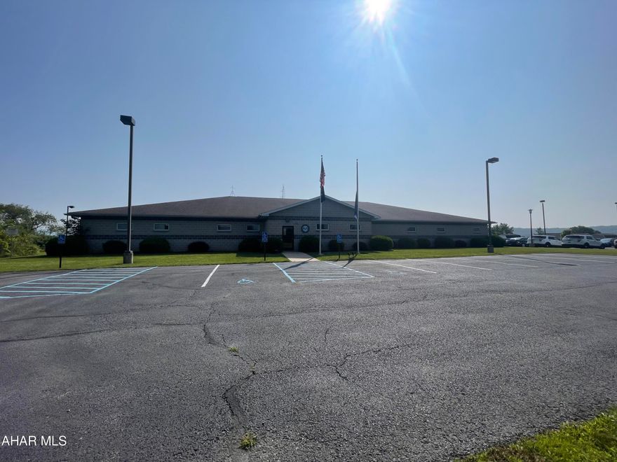 Investors!! This is a must for your portfolio. 2003 constructed building in Bedford Township with 10,256 sq ft. This block exterior building has a lobby with reception area. Offices. Conference rooms. File rooms. Copy area. Kitchen area. Two locker rooms with restrooms. Additional public restroom. 3 exterior exits. Garage area with workshop space. Fitness room. Lighted Parking Lot. All this on 5.737 acres.  Current lease in effect through July 14, 2025.  Please no drive bys.