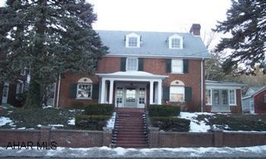 three story brick georgian rivel. Oak and pine hardwood flooring, woodburning fireplace, built in chaina cabinets, french double glass doors, open stairway, large foyer, lots of original features, and two car detached garage with studio.