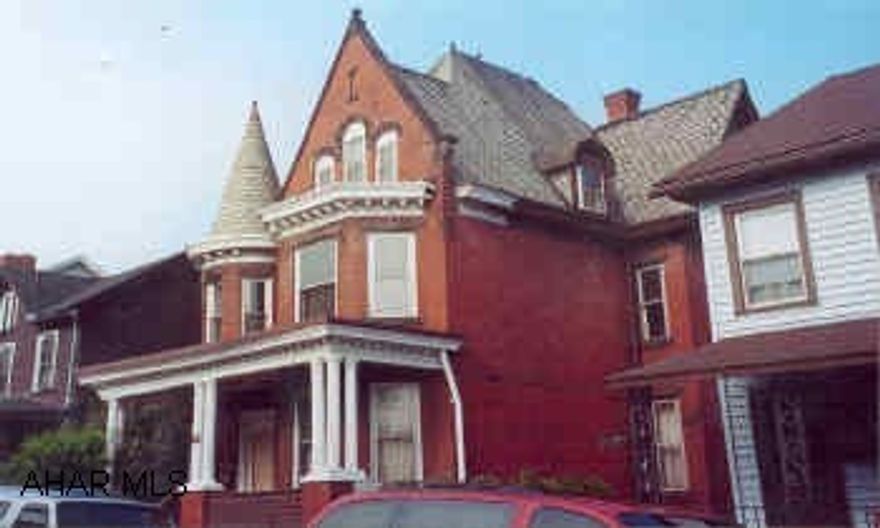 Brick 3 unit with seperate heat & electric.  New carpeting, off street parking.