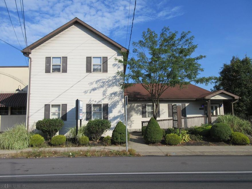 Duncansville 5 unit commercial complex. 22,000 cars per day approx. Features 2 first floor office suites each with approx. 1,450 sq ft plus 2 second floor apartments. Over-sized concrete block 2 car garage with storage above (rented mo to mo) and rear parking lot. All units are fully rented except 1 office suite which is currently vacant and for rent at $1,250 per month. Or move your business into the 1,450 sq ft office suite vacancy and start collecting your rents. Most all units have separate utilities except water/sewer. This property is a unique opportunity. Check it out.