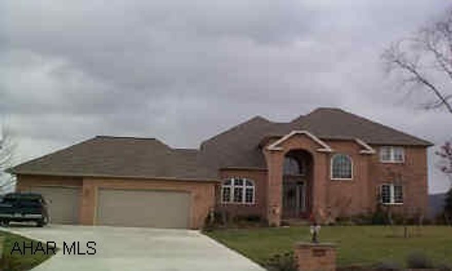 Extraordinary home with open, spacious floor plan.  All hardwood flooring on first level.  Gourmet kitchen with granite double oven, sub-zero frig., warming drawer, two sinks.  All rooms have overabundance of space and character with soft colors 9 ft. ceilings, crown molding and upgrades galore!  Tiled Florida room, den or office, formal LR and DR.  Dramatic master suite has fireplace, marble bathroom and jacuzzi and loads of closet space.  Huge finished, walkout basement rec room with 3rd fireplace, DR and full bath.  Central heating and AC with 3 zones, security system, 3 car garage.  Trex decking and fenced yard overlook large.  7742 lot with spectacular view.  See interior photos at www.carolgardiner.com