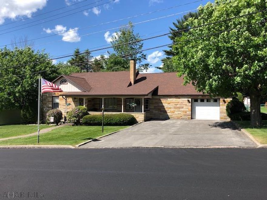 This well maintained property sits on a beautiful level lot in Cresson Borough.  Home is much bigger than it appears from the outside.  You enter the home through the bonus room that could be used for many purposes.  The eat in kitchen is very large and has plenty of cabinet/counter space.  The living room has a beautiful gas fireplace for winter evenings.  There are two spacious bedrooms and a full bathroom on the first floor.  The second floor has two additional bedrooms and a half bath.  The basement has a large family room, laundry room and bathroom.  The oversized garage is perfect to store all your toys. Roof was installed in 2012.  Hardwood floors underneath carpeting on the first floor.  Call today!