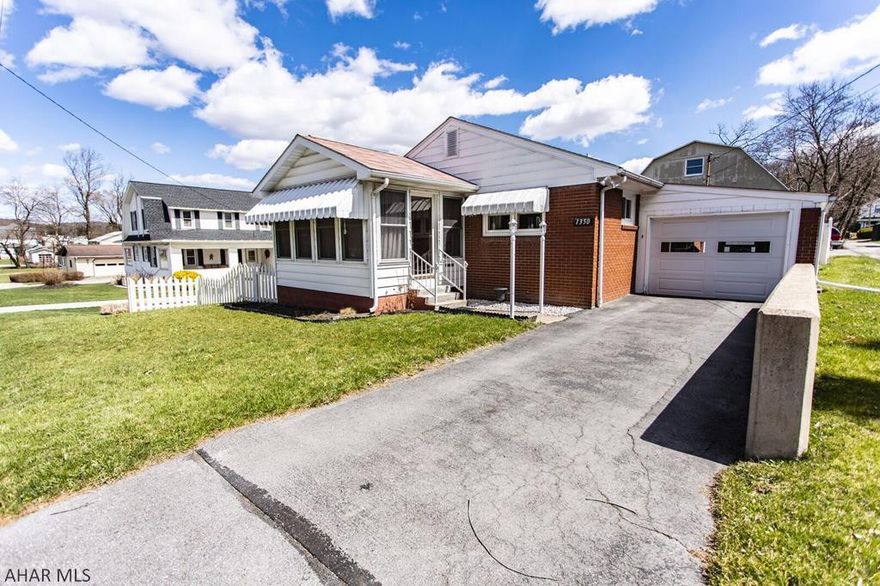 Location, Location, Location! Beautiful 2 bedroom in the heart of Tyrone Hardwood floors. Off street parking. 1 car garage. 3 season enclosed porch. Fenced in yard.