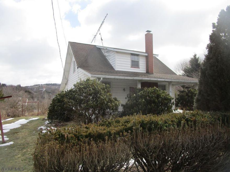 Solid 1.5 story home on 1.5 lots. This home has been well cared for over the years and features 3 bedroom, 1.5 baths, large living room with gas fireplace, den, formal dining room, kitchen, and enclosed porch.  Full basement with high ceiling and oil/ coal/wood combination furnace. 100 amp fuses. front and rear porches.  Detached one car garage. Great home for the money!