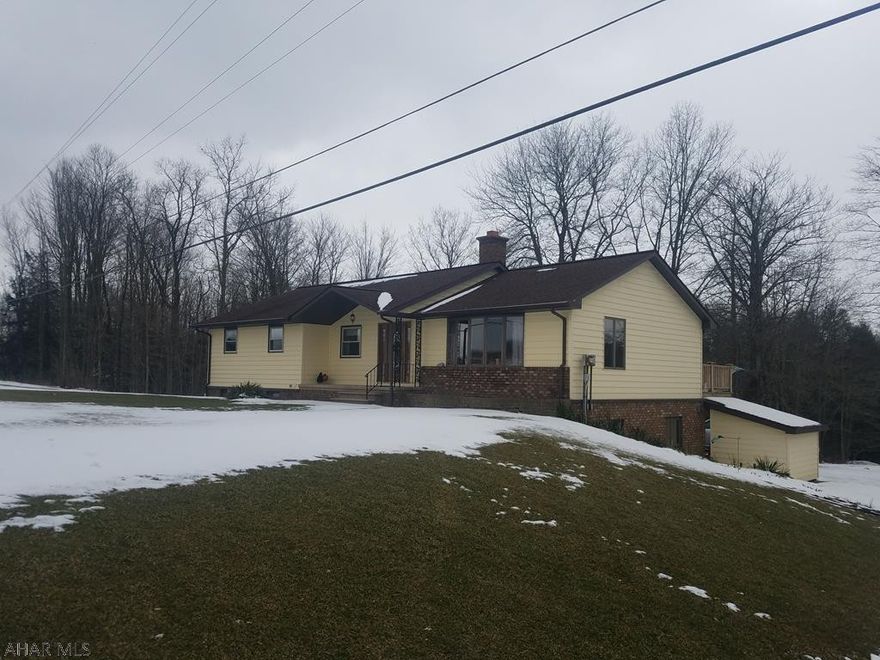 LARGE 4 bedroom 3 bath home in Cambria Heights school district. This home features an open concept for entertaining and a large laundry room on the first floor. The dining offers french doors leading to a deck the full length of the home. The master bedroom has a double closet and private bathroom. Enjoy the family and pellet stove in the basement that leads to a covered deck. The finished basement also features a bedroom bathroom and bonus room which can be used as a 5th Bedroom. The home sits on 2 acres with an above ground swimming pool. If you want a garage this home has that and MORE! The detached 3 bay garage has 2 industrial sized garage bays and a 1 car intergal garage. The detached 3 bay garage has water, heat and electric. Call listing agent for your private tour.