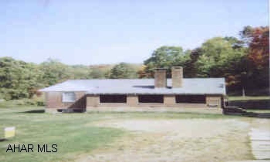 1 STORY BRICK RANCH APPROX 1 ACRE LOT, STONE GARAGE BUILT INTO GROUND NEEDS NEW ROOF, ETC.