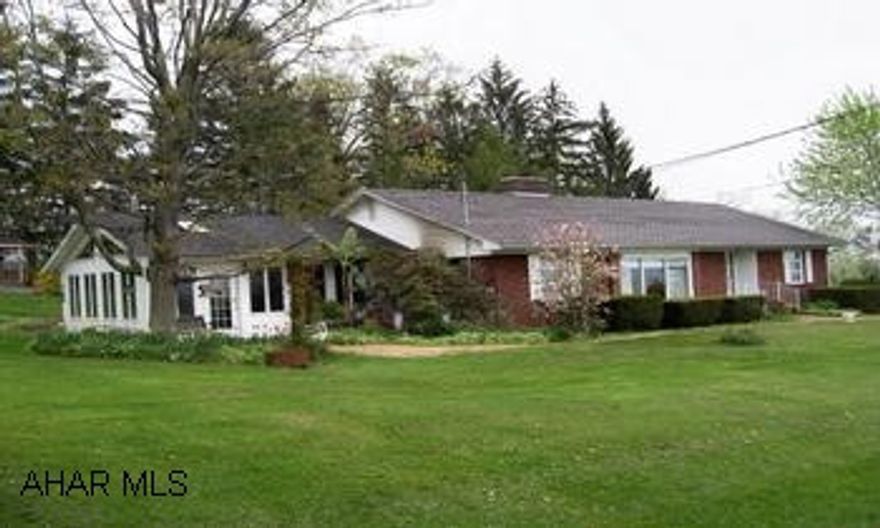 Brick Ranch home with large lot and mountain views. Brick home on 2.58 acres with great mountain views. French doors, spacious living room with fireplace, sun room, TV room, roomy country kitchen,  3BR/1BA. Garden, fruit trees, gazebo and outbuilding.