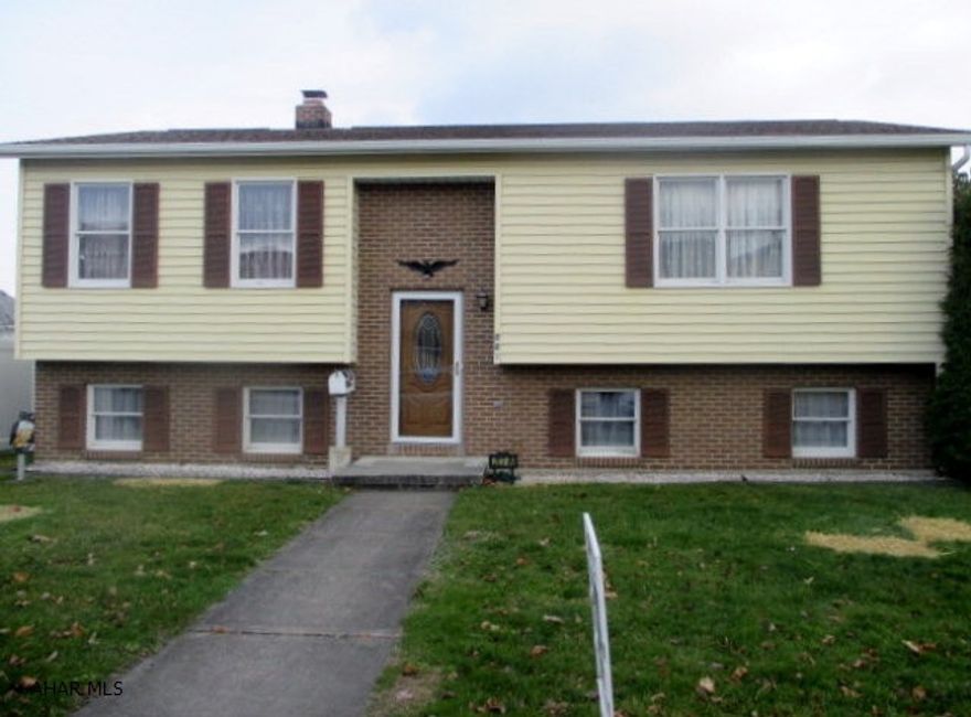 Great location for this 2 bedroom, 1 bath bi-level home within walking distance to schools and parks. This home has a 1 year old roof, new doors, central air, patio, deck and a 27 x 23 heated 2 car oversized garage and off street parking.  Large basement could easily be finished.