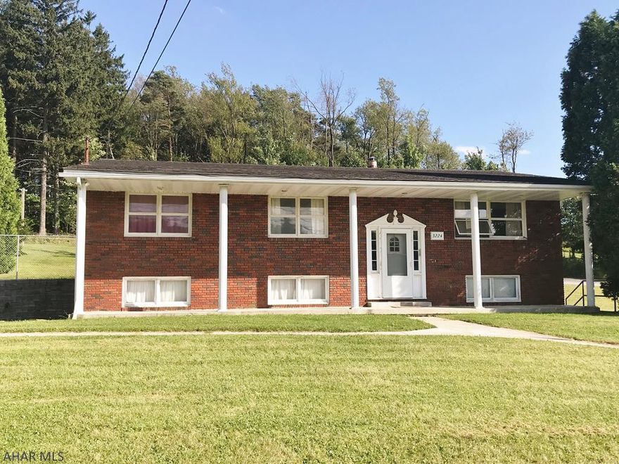 Best of both worlds, country living with a touch of town. This move in ready brick split entry home sits on 2 acres. Features include :  kitchen w/ceramic tile floor, 3 bedrooms, 2 full updated baths, hardwood floors throughout (some are covered by carpet) , partial finished basement , 2 car integral garage. Just minutes to Altoona.