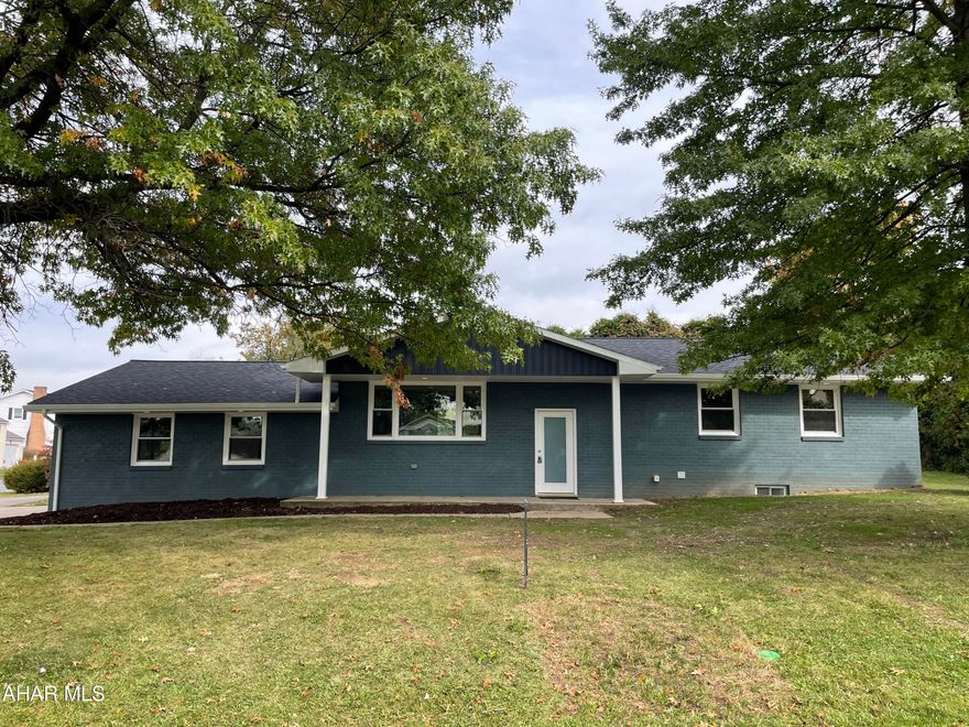 The moment you step inside this stunning brick ranch home and see that it has been completely renovated into a modern masterpiece you will want to call this one home!!! First appearances are everything.... The stunning hickory hardwood floors combined with beautiful lines of the black custom handrails will pull you in to see more.  Black and white kitchen yes please!!! Carefully laid out white cabinets and slow close drawers provide plenty of storage space, the black 9ft long granite peninsula is perfect for meal prep and provides additional seating during big family dinners.  The spacious and deep sink allows large pots and pans to be cleaned with ease! New windows and doors allow natural lighting to flow into the living and dining room area.  A spacious full bath and 3 bedrooms complete the first floor.  The lower level has been finished with tile floor which gives flexibility to use the space however you chose.  A spacious utility room provides plenty of storage.  Also on the lower level is a large bedroom and a 3/4 bath with sunken tile floor.  The large two car garage has also been transformed. Easy access to I99 and minutes from all that Altoona has to offer. Must SEE!