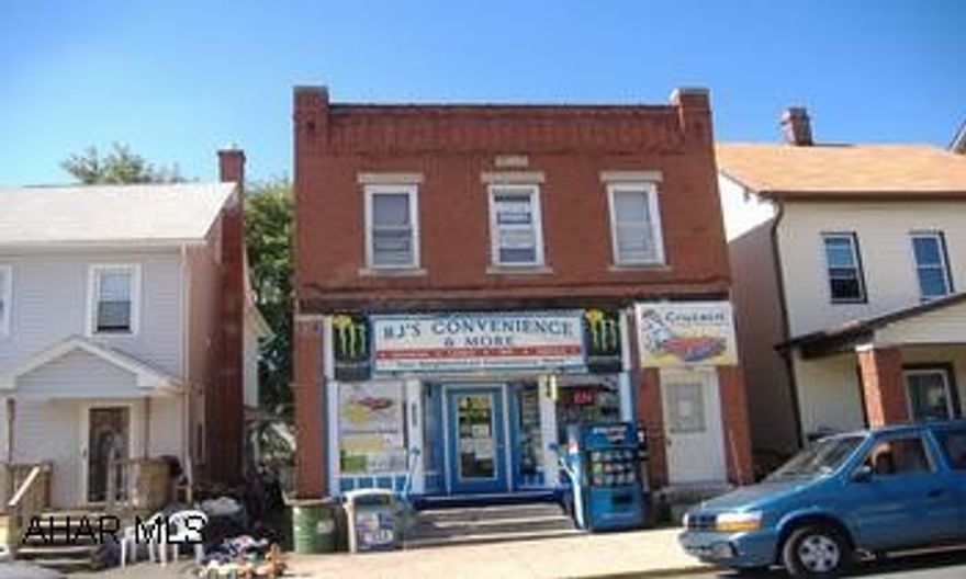 2 BED APT UPSTAIRS......SEPARATE ELECTRIC....CENTRAL AIR STORE IS BEING RENTED OUT ...NOTHING IN THE STORE IS INCLUDED IN THE SALE OF PROPERTY