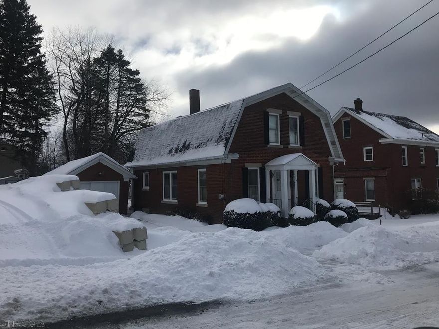 Well kept home. Original woodwork was restored to natural oak by owner.  Pocket doors in LR. Rear yard has extra area from prior acquisition.  Driveway is two strips of concrete with earth in between. Windows are original with storm windows.