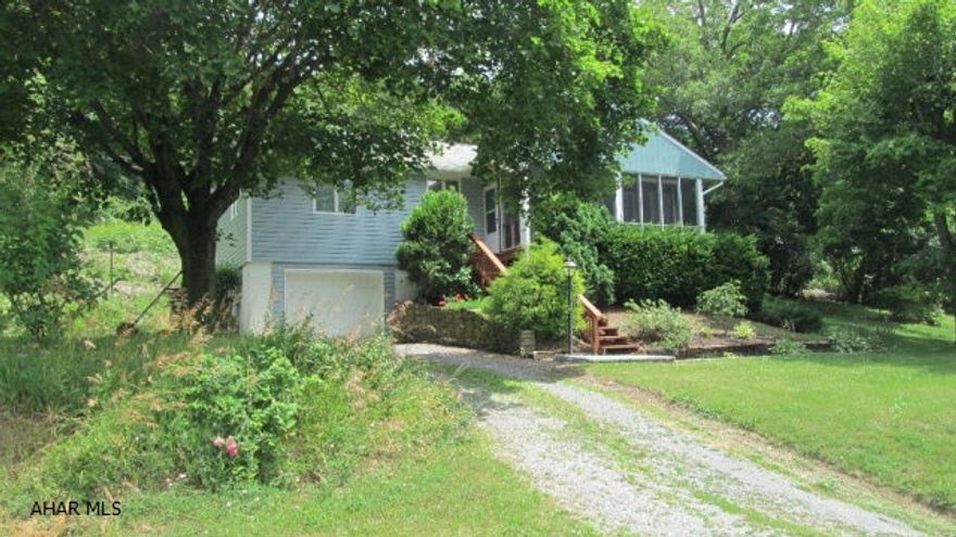 What a beautiful spot on the mountain with great views of the Cove. 3 BR, 2 Bath Raised Ranch on a dead end road with Hardwood flooring, Fireplace, Covered Porch, extra family room, and integral garage. Modern Bath and Kitchen. Great outdoor living. All appliances included. Plenty of wildlife with State Game Lands behind. Check out the location and the views!