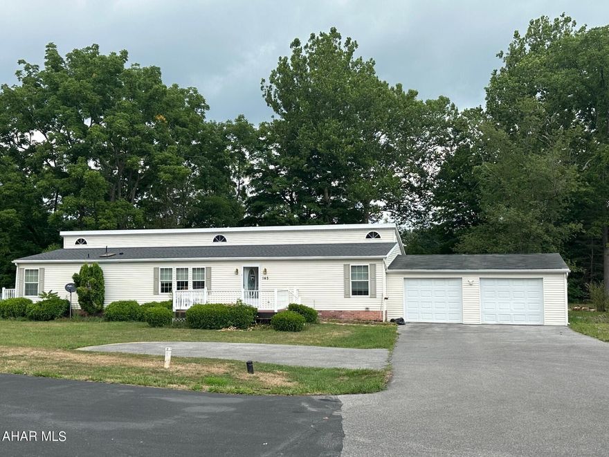 This lovely home tucked at the end of a private street has so much to offer.  Large open floor plan includes a huge eat-in kitchen with island, lots of cabinet storage and a beautiful built-in sitting nook.  Master suite boasts a walk-in closet and a large master bath.  Bonus room would be an awesome family/ game room or the perfect home office space.  The back deck is enhanced by the automatic retractable awning.  Both 2-car attached and 2-car detached garages allow for tons of storage, parking and/ or workshop space.  All this on just over an acre of ground bordered by a lovely creek.