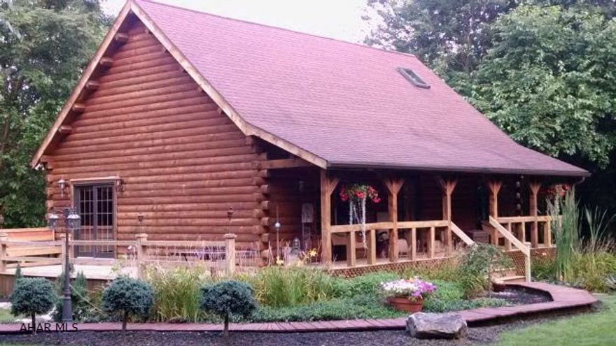 Here it is...That perfect log house, sitting in the woods total privacy...Yet so convenient! Better not miss this like new 3 bedroom, 3 bath, beautiful log home on 5.33 private acres, 16 x 36 shed, beautiful landscaping.