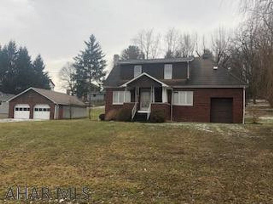 Very private location sits this 3 Bedroom, 1 Bath home on large lot, large 2 car detached garage.  There is an additional lot next door that will go with the house to make a total of over 1/2 acre of land.  Property is being sold "as is".
