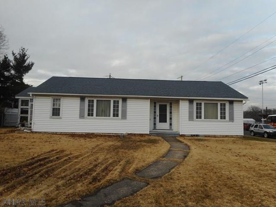 Handyman house. Great location for this vinyl sided rancher with two car garage. Large living room with fireplace. Being sold as is including most remaining contents. House needs interior remodeling but is a  great opportunity to gain some sweat equity.