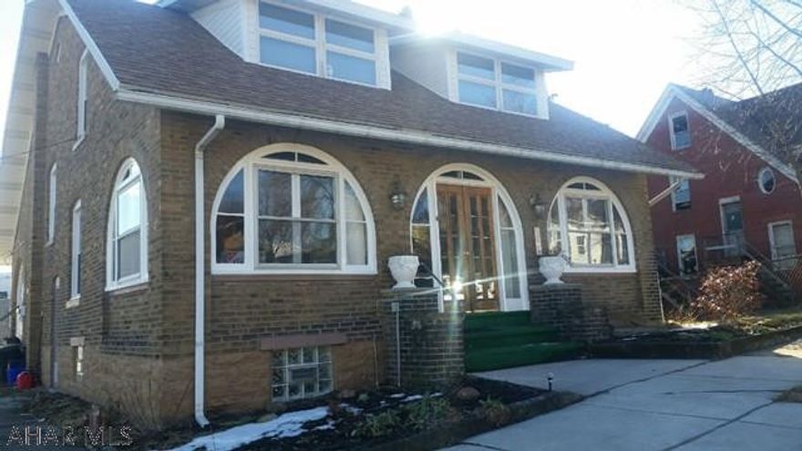 Beautiful 4/5 bedroom, 2 bath brick home featuring swimming pool, pool shed, 2 car detached garage, new roof and remodeled bathrooms. Also included is a 2 unit fully rented duplex with gross rental income of $1,135 a month. Tenant pays electric and cooking gas.