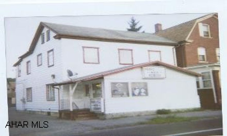 Beauty shop (6 stations) with 2 bedroom apartment on 2nd floor. Stove included. Includes all equipment. Shop is closed Sunday & Monday - can be shown then.