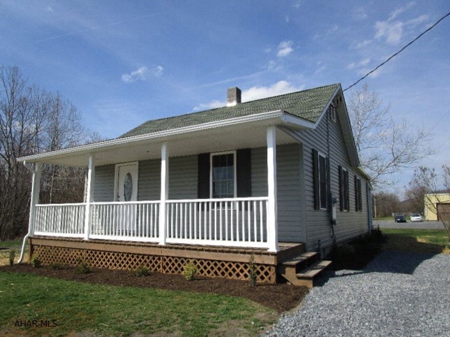 This home has been remodeled inside and out!!  Looks like a brand new house!  Updates include new vinyl siding, thermo pane windows, front and rear porches, new drywall ceilings and walls, floor coverings, new bath, new kitchen and 200-amp electric.  It features a living room, kitchen w/ hickory cabinets, dining area open to the kitchen, two bedrooms and a full bath.  Convenient location close to town, level yard, next to walking trails and a large stream.  This is a really nice home, move in ready, low, low taxes and low maintenance.