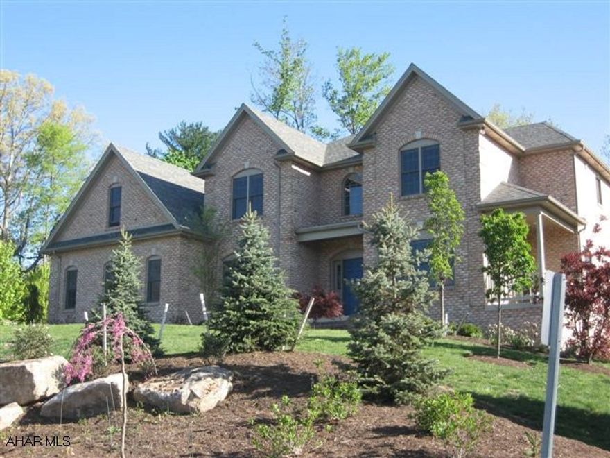 Over 4,200sf of living space in this wonderful custom built home with superior craftmanship and flowing floor plan. Beautiful hardwoods. New eat-in KT with Cherry cabinetry, wall oven and warming drawer with gorgeous granite countertops and serving area off of the formal dining room. The sitting/LR has its own private covered side porch and the FR houses a beautiful black granite fireplace. A 3season room overlooks the rear yard. The 2nd fl with its large open hallway features 4BR including a great master suite with garden jacuzzi tub and 2 huge walk-in closets. Finished lower level has rec room, office and separate entrance. Wine lovers will adore the custom built wine cellar off of the FR. This custom home, built by Metz Biilders, is situated on a lovely .77ac private wooded lot