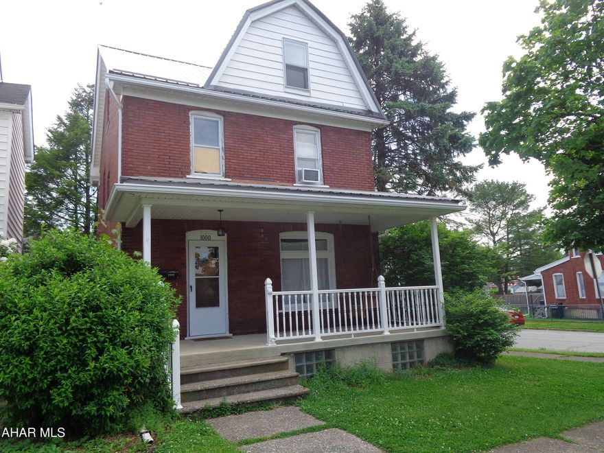 Attractive  brick home on a corner lot with a brand new metal roof installed (May, 2026).  Updated kitchen and bathrooms, hardwood floors and a 1st floor bathroom.  A  2 car garage with a 2nd story for storage.  The attic could be a 4th bedroom.   Currently approved for student housing.  Was recently appraised for $122,000.