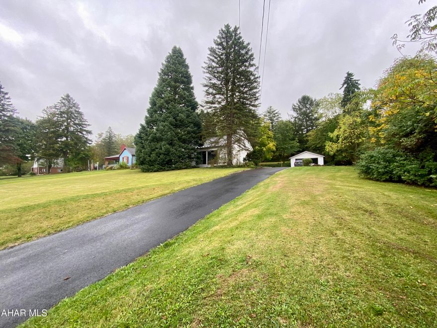 Situated on .60 of an acre this 3 bedroom 1 full bath home is move in ready and waiting for you!  The first floor features hardwood floors, a modern kitchen with stainless steel appliances, and so much more!  The second floor boasts a large bedroom with built in beds, shelving and desk.  Step out back to a large lot with patio, and parking perfect for entertaining.  The detached garage is set to have new garage door, and automatic opener with remote installed in next two weeks.  A maintenance free home like this will not last. Schedule your private showing today!