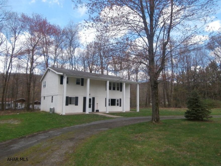 Bi-level on over 6 acres. Newer carpet, basement family room with extra flue, 3 car shed, great location! Land is level and has a large yard area with balance wooded.