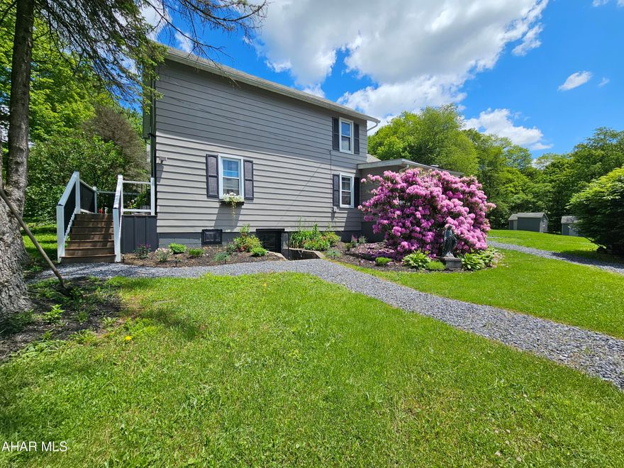 Beautifully remodeled 4-bedroom, 1.5-bath home featuring a spacious garage that accommodates approximately 6 cars. Perfect for a workshop or car collection, this home exudes charm and warmth throughout, making it both inviting and cozy. With a distinct farmhouse feel, it combines rustic elegance with modern comforts.  From the welcoming front porch to the living areas adorned with shiplap walls and new flooring, every corner of this home radiates charm. The kitchen, with its stylish island, is a delightful blend of style and functionality. Each bedroom offers a serene retreat, while the bathrooms boast vintage-inspired fixtures. The master bedroom and half bath on the first floor provide convenience and comfort, and the laundry room is also conveniently located on the first floor. Outside, the large garage provides ample space for car enthusiasts or hobbyists, enhancing the home's appeal. This home is the perfect blend of cozy and practical, ideal for those who appreciate both beauty and utility. Enjoy the sunrises and the sunsets from your porch! (Preapproval buyers only. Buyers to confirm taxes,  sq footage,  and lot size).