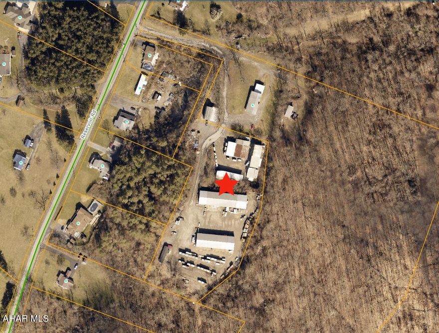 Former Hollidaysburg lumber yard on 3.31 acres with 4 very large covered storage buildings plus single wide mobile home/office building. Located in the Loop area of Blair Township with no zoning for many possible uses such as lumber/milling yard, equipment storage, manufacturing, auto or truck service. Could also be used for retail sales of landscaping supplies, building components, rental equipment, farmer's market, etc. just to name a few.  The possibilties are truly endless! 16,852 square footage of combined storage buildings is approximate.