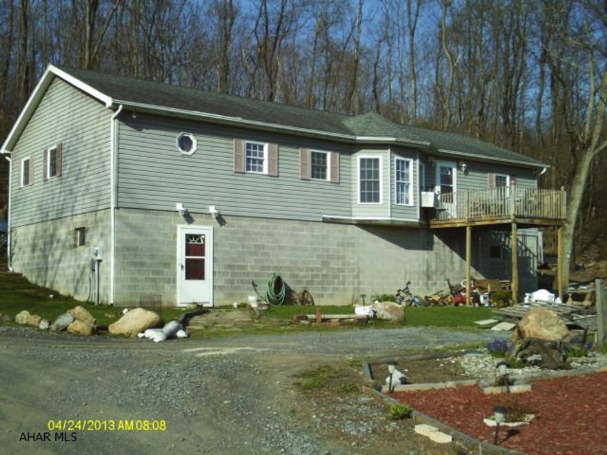 Custom built Raised Ranch - 3 bedroom, 2 full bath nested on 2.1 acres, cathedral ceilings through out, master bath with jacuzzi tub, large rooms, large oak kitchen with breakfast nook, private setting.