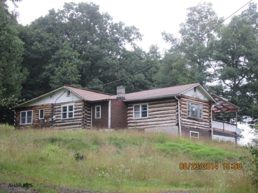 This log home would make a Great hunting lodge. State gamelands less than 1 city block from property. Deer on this property every time I am there. Lots of possibilities. Handicap accessible.