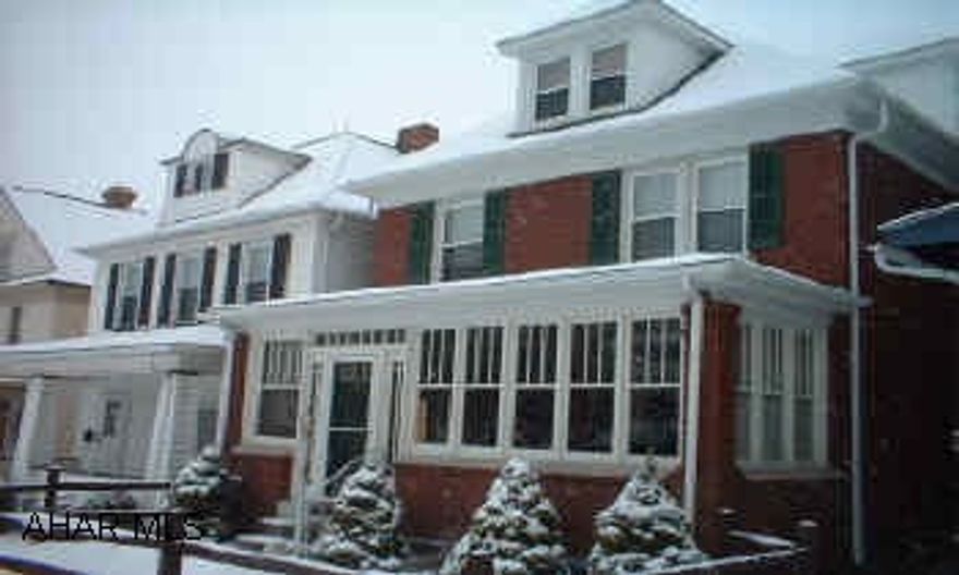 Beautiful 2 1/2 story brick, hardwood floors in LR and DR, oak kitchen, covered deck, huge bath.  Finished 3rd floor, enclosed sun room, leaded glass door and window.  Home recently insulated.