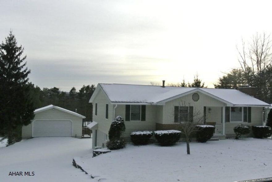 Feel secluded on Frankstown Mountain in the lovely Sylvan Hills area.  This beautiful home, with its new kitchen, hardwood floors, spacious bedrooms, and 2 fireplaces....has it all when you combine it with the magnificent views from the rear deck.  Just move right in this exquisite home!! It is all modern and ready to go!  This home also features 2 shed storage areas....AND...a fantastic oversized 2-car garage with a workshop.   Call for an appt for your own private viewing.