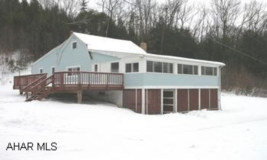 VINYL SIDED OVER LOG HOME. L-SHAPED ENCLOSED PORCH. NEW VINYL WINDOWS AND EXT. DOOR. WOODBURNER INSERT IN STONE FP. OVERSIZED 2 CAR GARAGE W/OIL PIT. PAVED DRIVEWAY & PARKING AREA. VINYL SIDED OVER LOG HOME. L-SHAPED ENCLOSED PORCH. NEW VINYL WINDOWS AND EXT. DOOR. WOODBURNER INSERT IN STONE FP. OVERSIZED 2 CAR GARAGE W/OIL PIT. PAVED DRIVEWAY & PARKING AREA.
