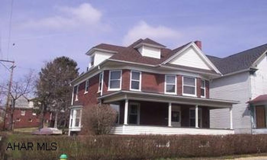 Full attic unfinished. Spacious 4 bedroom brick, hardwood floors, wood fireplace, new vinyl windows, 5 year old roof, large corner lot.