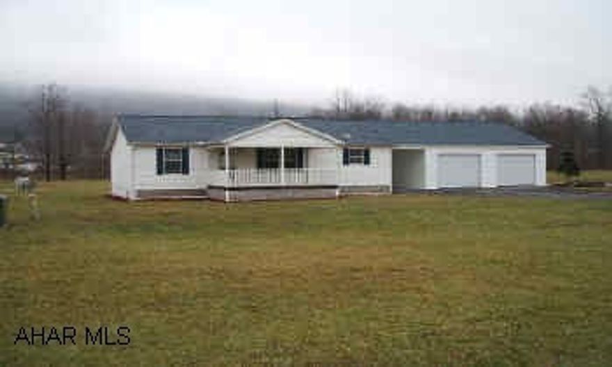 1999 Doublewide on Privately Owned Ground.  Brand new 2 car garage. Lovely 1999 Champion Doublewide.  Great location.  Excellent condition - Hardly lived in - Beautiful front and side porches.  Very, very nice.