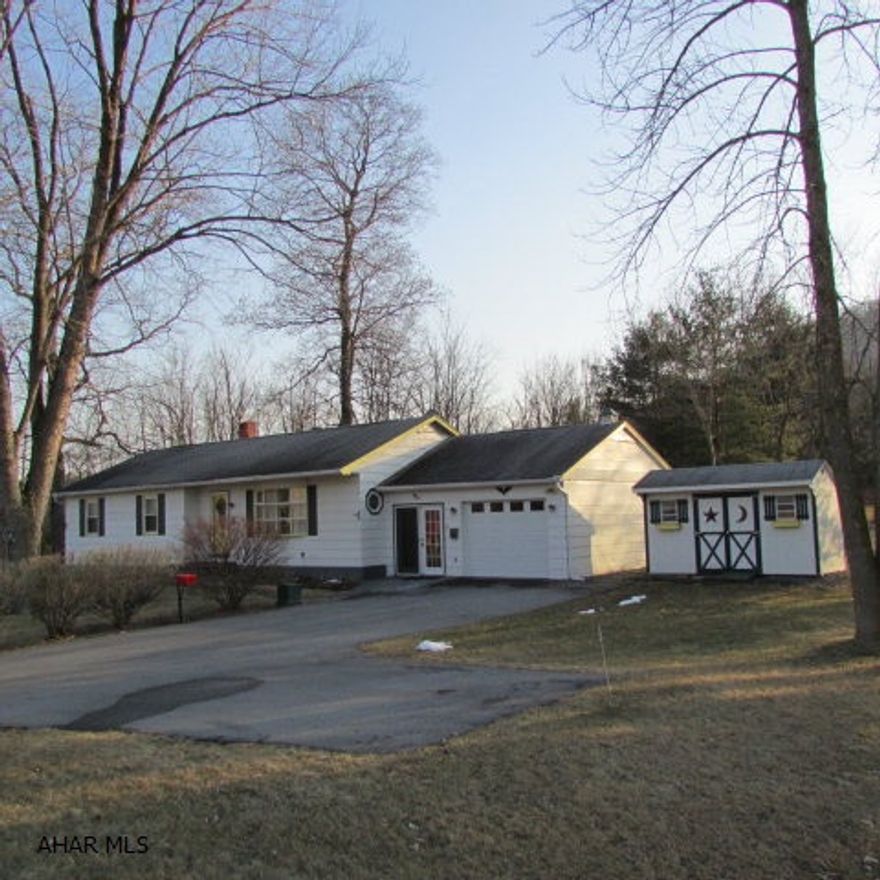 Spacious rooms in this rancher on over 1/2 acre.  Centrally located between Altoona, State College and Huntingdon. In Juniata Valley School District. 20 minutes to Raystown Lake boat launch at Snyder's Run. Needs some updating but has country charm in a country setting.  Stream runs along the back line of the property.  17x7 sunroom to enjoy the summer evenings. Attached garage plus breezeway area. Shed included. New outside doors! Three bedrooms with 1.5 baths. Hardwood floors!! First floor laundry is convenient. Master Bedroom has 1/2 bath.  Nice-sized main bath. Bigger closets throughout.  The basement is heated and can be finished for additional living space. A lovely home - worth taking a look at!
