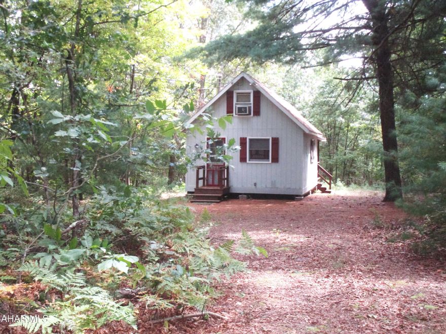 Neat A-frame cabin featuring a cathedral ceiling; loft; wood stove; relaxing porch; electricity; new architectural, lifetime shingles & 4 new skylights in 2020-21; new post/frame shed in 2016-17; &, a ''privy''. Peaceful surroundings near St. Game Lands, Buchanan St. Forest, Green Ridge & the Maryland State Line.  Current H.O.A. yearly fee is $275.00 for rd. &, pond maintenance.. Green Mountain Community Assoc., Inc.  restrictions apply; common amenities include 15+- ac. & a pond.  SELLING AS-IS.