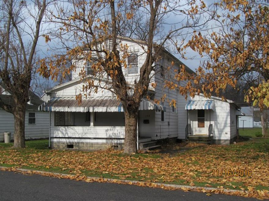 Lots of potential in this 2 sty fixer upper.  Possibility to divide into 2 units.  Large lot, over half an acre. Or keep as a single family home.