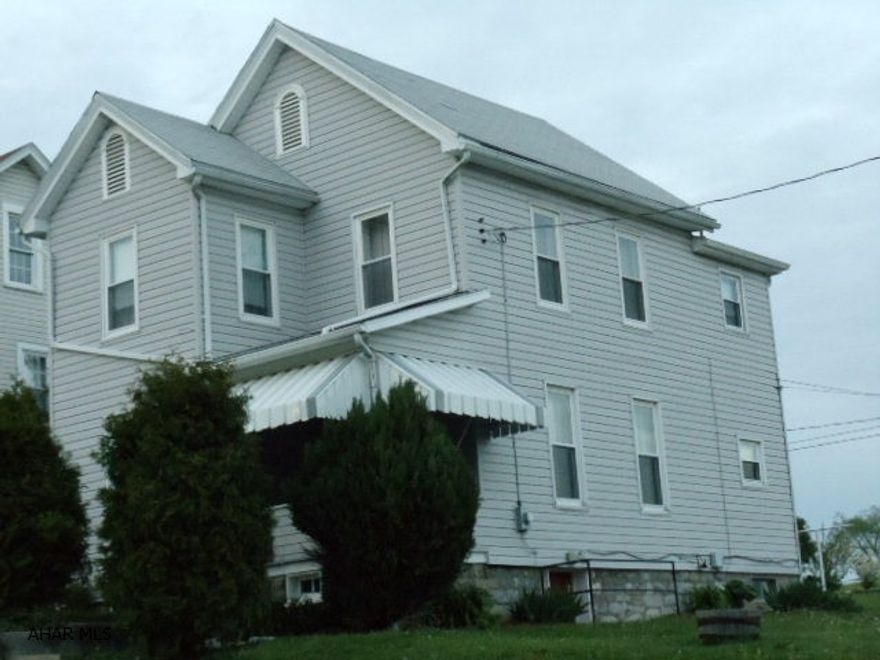 Nice vinyl-sided home, w/vinyl windows, new carpet, updated kitchen & bath, central air, new front awning & sidewalks, 1-car garage plus concrete parking pad. New oil furnace plus electric heat pump back-up.   #J-129