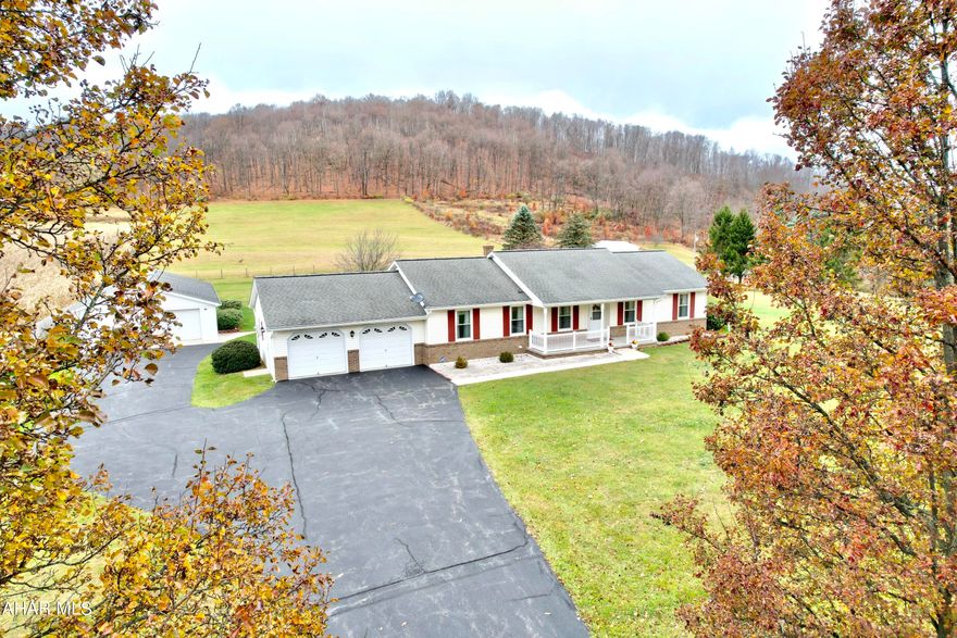Nestled in the mountains of Southern Pennsylvania is this beautiful ranch home on 10+ acres.  This well maintained home has the space for enjoying the amenities it boasts.  The views of the surrounding mountain ridges can be seen all around this home.  Sit on the front porch or back porch and watch the magnificent wildlife.  There is plenty of land for a hobby farm or horse farm.   This 3 bedroom 2 bath home comes with an attached 2 car garage and a detached garage that has room for 5 vehicles.  The additional shed is great for lawn equipment or other off-roading equipment.  Close to I68, I99, Pa turnpike,  Deep Creek Lake, Rocky Gap State Park, Shawnee Park, Buchanan State Forest, state game lands, and so much more.