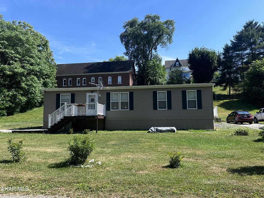 This 3 bedroom, 2 bathroom home could be just what you're looking for in the Raystown Lake area. This would make the perfect home away from home for those weekend getaways or your forever home...This property offers a double lot with full utilities hook up. There is plenty of room to add a rental home for additional income. This lot offers plenty of space to park a boat, RV or build a large garage. Located off the beaten path, yet just a few minute walk to town. The town of Saxton features a fabulous  food market, small boutiques and awesome eateries, it represents small town America to the core. You are within 10 minutes of the Weaver's Falls boat launch, from here you can explore the 8,300 acres of beautiful Lake Raystown, where you will no doubt find eagles soaring in the sky above you and deer on the banks of the lake. The lake is surrounded  by 21,000 acres of forested mountain slopes. 

Bonus: Also, close to State Game Lands and Warriors Path State Park to add to all your nature loving enjoyment!