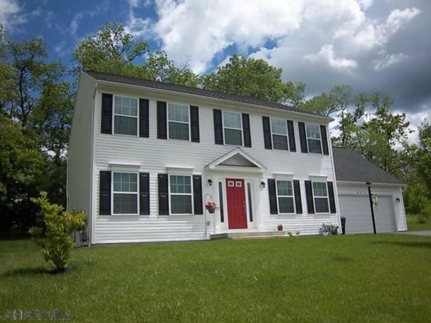 Rolling Hills North. This 4 bedroom, 2.5 bath home features a spacious kitchen w/granite counters, island, ss. appli. & tile floor. Dining rm w/hardwood floors. Living rm & family rm have bamboo floors & a pocket door between the rooms. 2nd floor master bedroom has a 7x21 walk in closet. Master bath has tile floor, double sink & new glass shower with tile surround,  granite & garden tub.Three additional bedrooms, full bath & a convenient 2nd floor laundry.  Large basement could easily be finished. Access from the kitchen to a private, wooded backyard with patio pavers creates a perfect place to relax & entertain. Attached two car garage completes this ready to move in home. This is an S&A home with many upgrades.