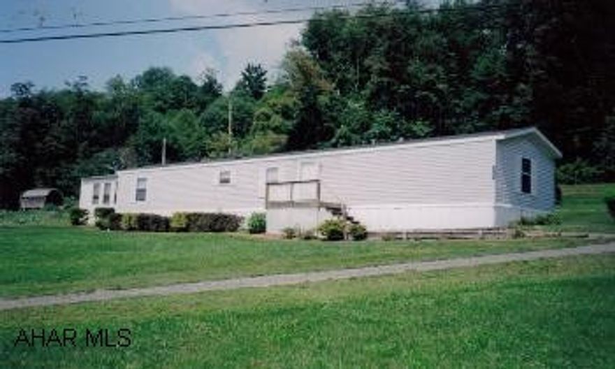 Nice 3BR/2BA Hollly Park Mobile Home on larbe 1.27 acres with scenic view. Home includes modern kitchen w/appliances, large living room, utility room , bonus room and covered rear porch. Property also offeres a 12'x24' Esh Barn and storage shed.